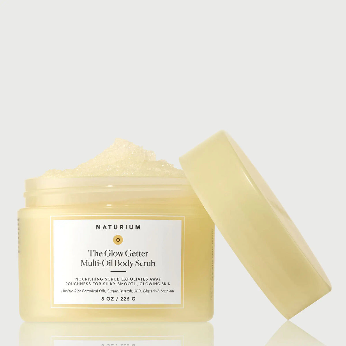 the-glow-getter-multi-oil-body-scrub-g7 NATR-40028-GlowGetter-Multi-Oil-Body-Scrub-Front-CapOff-bonebkgd.webp
